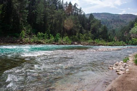 Fast river with rapids high in the mountains Stock Photos