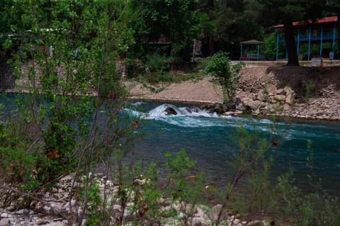 Fast river with rapids high in the mountains Stock Photos