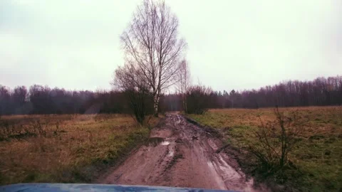 Fast off-road traffic in the forest with mud Stock Footage 225058969