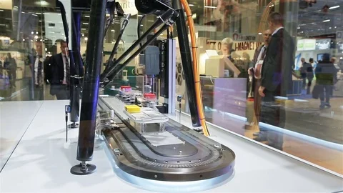 A fast robot packs different objects into moving containers. Stock Footage 81009810