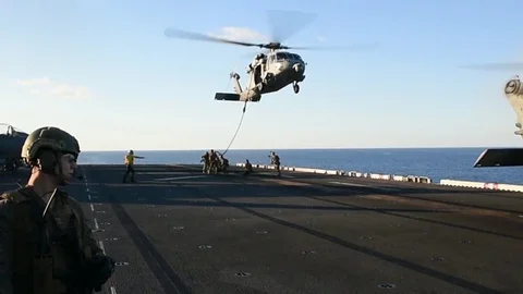 Fast roping with MH-60 Seahawk helicopte... | Stock Video | Pond5