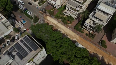 Fast rotating aerial drone view of road paving and infrastructure renewal works Stock Footage 341056434