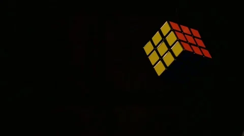 A fast rotating Rubik´s cube isolated on a black background Stock Footage 60672070