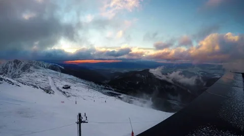 Fast running clouds over Low Tatras with magic sunset. Chopok mountain 2024 mete Stock Footage 64213174