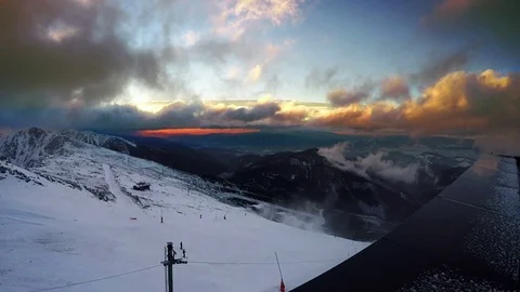 Fast running clouds over Low Tatras with magic sunset. Chopok mountain Stock Footage 69777640