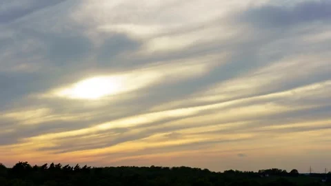 Fast running clouds in the rays of the sunset. 4k time lapse Stock Footage 275089327