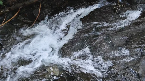 Fast rushing white water stream in slow motion Stock Footage 104752217