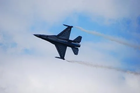 Fast sharp jet fighter flies by with slow speed Stock Photos