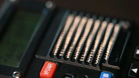 Fast slide from bottom to top of a modern handheld HAM radio that lights Stock Footage 171955607
