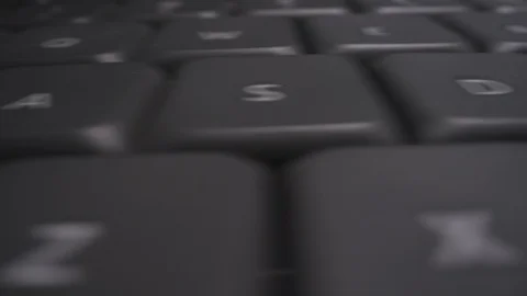 Fast slider across computer keyboard macro keys Stock Footage 125831040