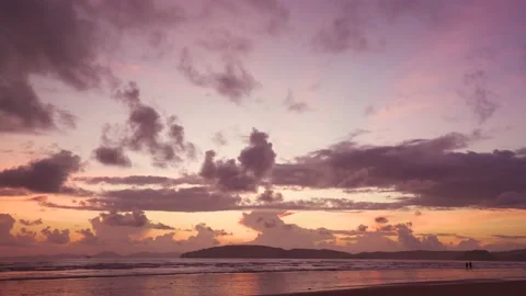 Fast Speed couple walking on the beach during sunset Stock Footage 153507932