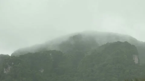 Fast speed Heavy Rain Falling with cloud and mist over mountain Stock Footage 153506259
