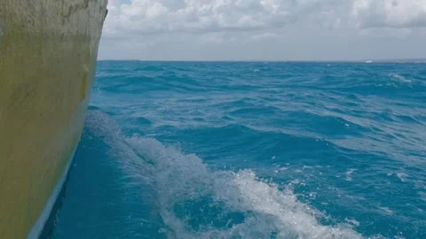 Fast Speedboat Riding Through Waves on Blue Tropical Sea Stock Footage 274452735