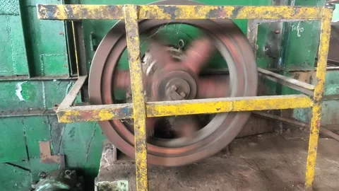 A fast-spinning flywheel rotates with powerful momentum. Stock Footage 309405002