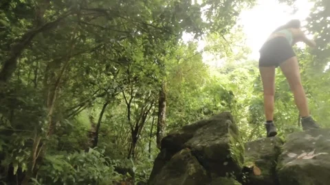 Fast spinning horizontal pane view to the back side of a young female woman slim Stock Footage 245446816
