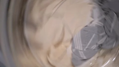 Fast Spinning Laundry Inside A Washing Machine Drum During Wash Cycle Stockbeeldmateriaal 332666304