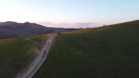 Fast SSV Riding fast to Mountain Ridge at sunset Video stock 198739265