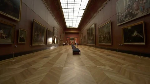 Fast steady shot through art gallery, few visitors Stock Footage 70180249