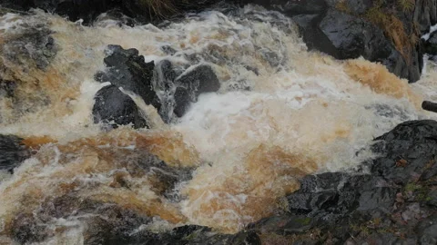 Fast stream of waterfall alongside rocks and stones in Karelia, Russia Video stock 165334058