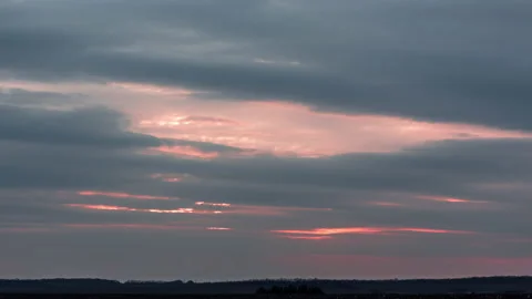 Fast striped clouds during sunset Stock Footage 153755967