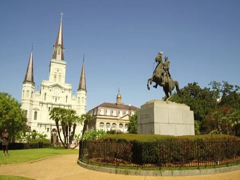 Fast tilt to the Andrew Jackson statue and St. Louis Cathedral in New Orleans Stock Footage 81157124
