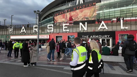 Fast tilt down from blue sky to entrance to the Emirates Stadium, Highbury Video stock 305142372
