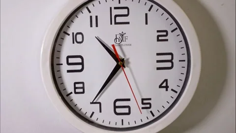 Fast Time-Lapse of a White Office Clock With a Red Second Hand Stock Footage 337788344