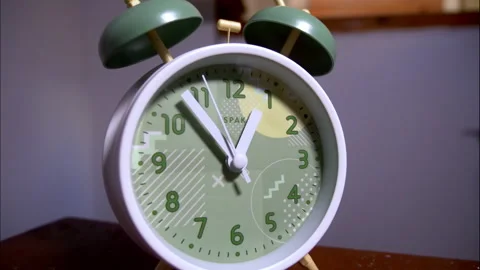 Fast Time-Lapse of a White Retro Alarm Clock on a Wooden Table Stock Footage 338297013