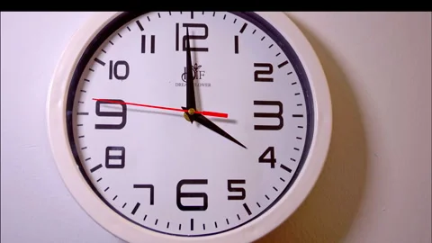 Fast Time-Lapse of a White Wall Clock With a Red Second Hand Stock Footage 337900061