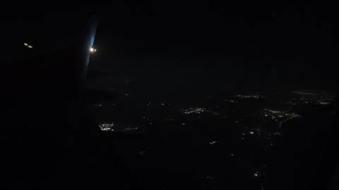 Fast Timelapse of Airplane Wing Gliding Over City Lights at Night Stock Footage 319030302