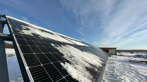 Fast timelapse clearing snow from solar array as sky turns blue Stock Footage 327430930