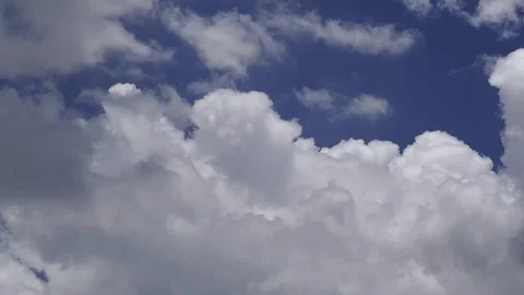 Fast timelapse moving spinning cloud formation over blue sky Stock Footage