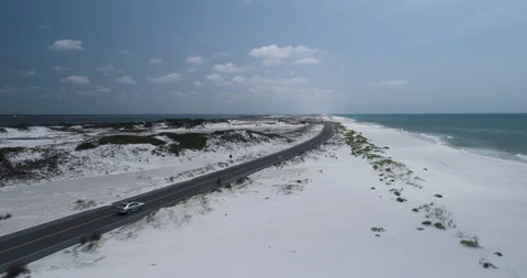 Fast tracking shot of cyclist and cars on Santa Rosa Island drone aerial 4K Stock Footage 111416513