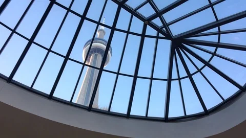 Fast tracking shot of Toronto's CN Tower viewed from inside on clear day Stock Footage 88554702