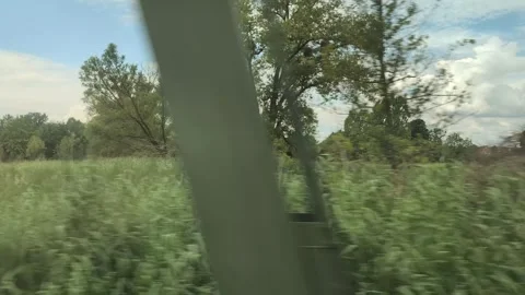 Fast train driving through German countryside, window pov Video stock 321853281
