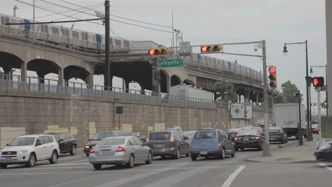 Fast Train Going Over Bridge Above Busy Street Stock Footage 100852055