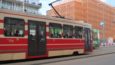 Fast train speeding on scheveningen street with buildings in the background Stock Footage 213915641