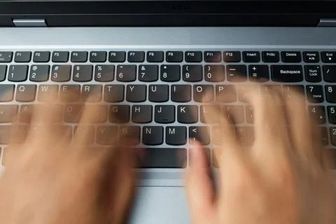 Fast typing on laptop Stock Photos