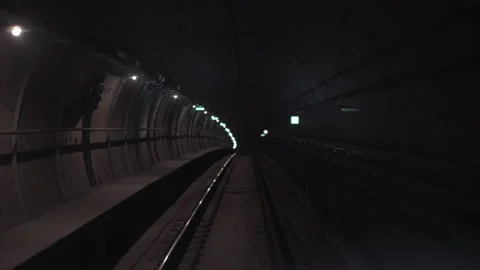 Fast underground train riding in a tunnel of the modern Copenhagen city Driver Stock Footage 134384294
