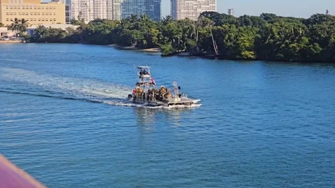 Fast utility boat sailing through Port Everglades waterway in Florida Stock Footage 341570123