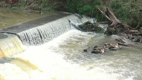 Fast water flow in a river with lots of natural rocks Stock Footage 211649759