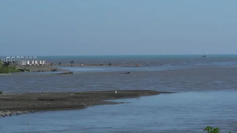 Fast  waters of Vulan mountain river flow into Black Sea. Mouth of Vulan River. Video stock 155115245