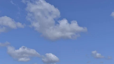 Fast white clouds in the blue sky timelapse Stock Footage 94183878