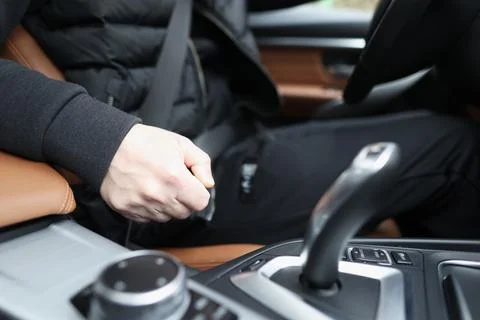 Fastened driver sits in car with automatic transmission Stock Photos