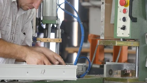 Fastening of a metal skeleton inside plastic profile. Factory for PVC windows 스톡 동영상 96520577