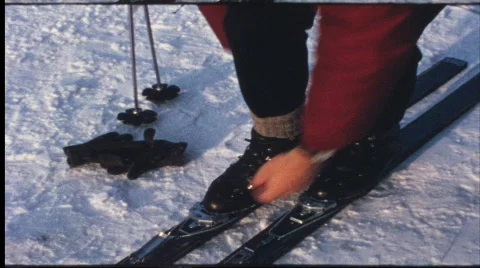 Fastening old fashioned ski binding (vintage 8 mm amateur film) Video stock 824714