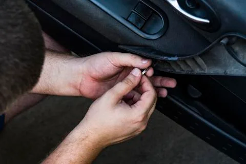 Fastening the panel with the hex key. Stock Photos