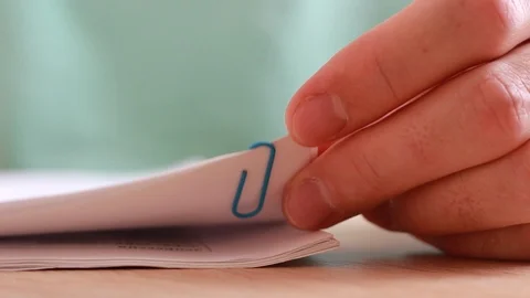 Fastening papers with paper clips Stock-Footage 87545672