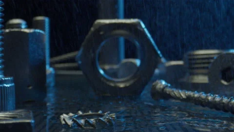 Fastening tools under falling rain in studio at blue light Stock Footage 204907160