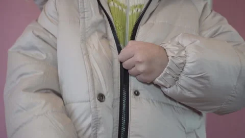 Fastening a zipper on a jacket Stock Footage 306352826